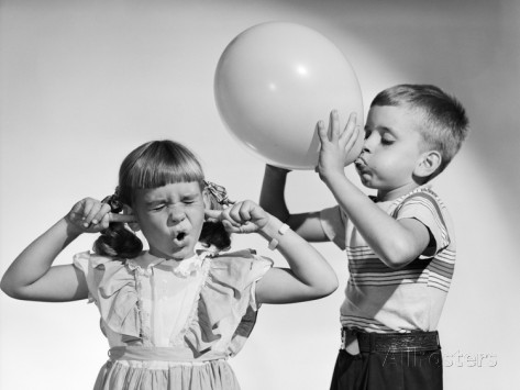 1950s-little-boy-blowing-up-big-balloon-little-girl-with-fingers-in-ears-eyes-closed